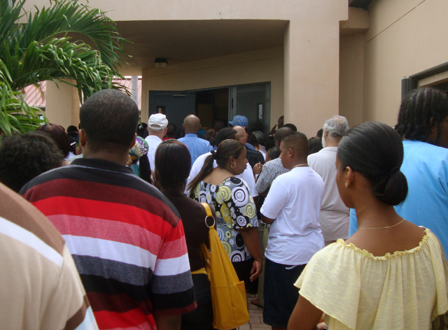 Shortly after 10 a.m. Wednesday, more than a hundred hopeful job applicants crowd the front of UVI's Great Hall.