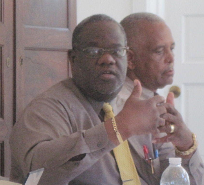 Attorney General and board member Vincent Frazer and board member Gordon Finch.