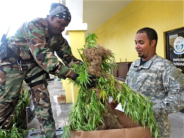 Special Operation Bureau officers bag evidence back at headquarters.