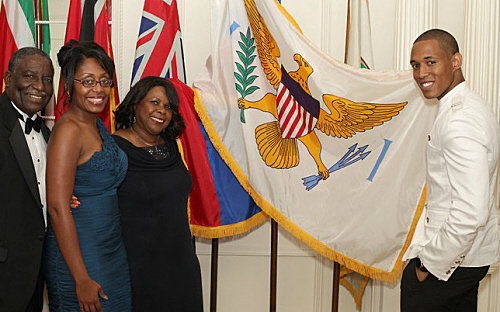Tourism Ambassador Sambala Boyd (right) displays USVI flag with (from left) Lt. Gov. Gregory Francis, Department of Tourism Director of Sales Kay Milliner-Kitchens and Helen George Newton of the VI Freshwater Association.
