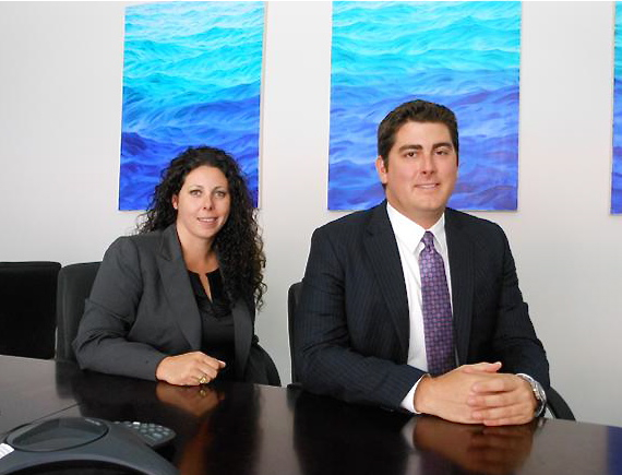 Attorneys Erika Kellerhals and Greg Ferguson in their conference room.