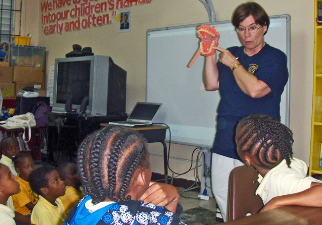 Susan Anderson teaches dental health to students at Jane E. Tuitt Elementary School.