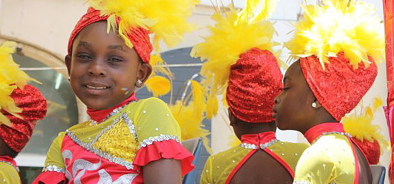 Five-year-old Regine Williams, left, joins her fellow mascots from the St. Thomas Majorettes. (James Gardner photo)