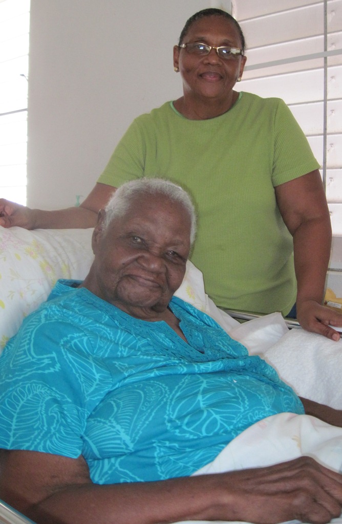 Ella Jane Samuel Hodge (pictured with daughter Yvonne Wells) turns 100 on May 29.