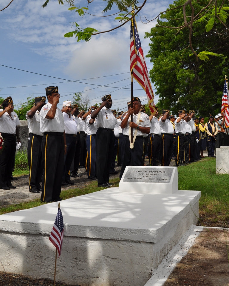 American Legionnaires salute the grave of Korean War veteran Private 1st Class James H. Dowling.