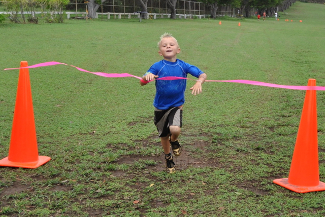 Six year old J.J. Klempen crosses the finish line in first place.