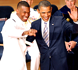 Ensign Jevron James and President Barack Obama acknowledge James' relatives at the Coast Guard graduation.(Photo courtesy Charles Coleman)