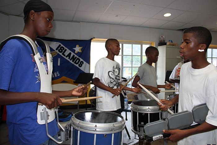 Incoming freshman drummers at CAHS get lessons in music from Dion Parsons.