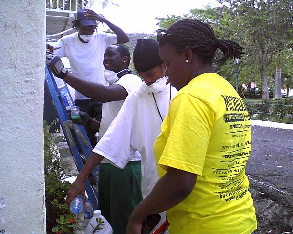 Raheem Miller, Avery Martin and Makeem Tonge from My Brother's Workshop join University of Michigan student Dayna Cole in a cleanup of the St. Thomas Historical Trust building in Charlotte Amalie.