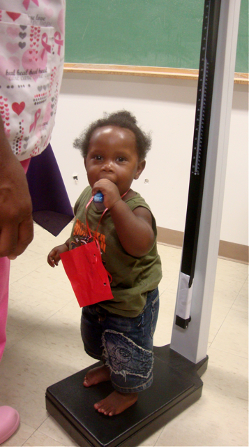 1-year-old Ezekiel Fontaine weighs in at 26 pounds Friday at the Children's Health and Wellness Fair.