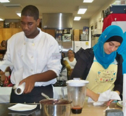 IQRA students Ameer Donaie (left) and Nawal Rashid clean up after the competition. 