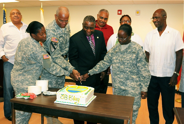 From left, Sgt. Maj. Hollis McIntosh, Maj. Gen. Renaldo Rivera, Lt. Gov. Gregory Francis, and Pfc. Danah- Marie Clarke cut the VING birthday cake at the 38th birthday celebration for the VING. (Photo by Sgt. Juanita Philip-Mathurin, provided by the V.I. National Guard)