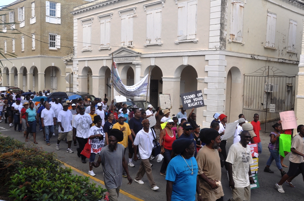 A group of angry Labor Day protesters march down King Street in Christiansted.