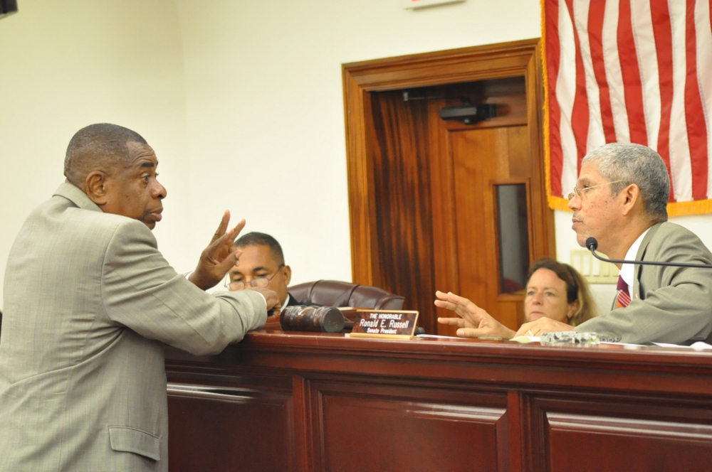 Senate Majority Leader Celestino White and Senate President Ronald Russell confer during Tuesday's session.