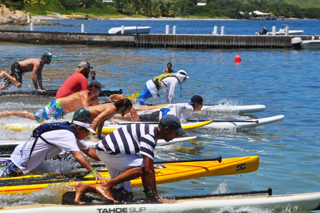 Paddlers hit the water for the six-mile elite race.
