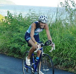 Theresa Harper is all smiles as she cruises into first place in the bike portion of the race.