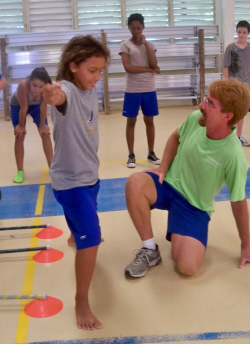 Coach Patrick Ramsdell helps Amada Ruparelia with her form.