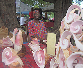 Junie Bomba displays his Conch Shell Creations.