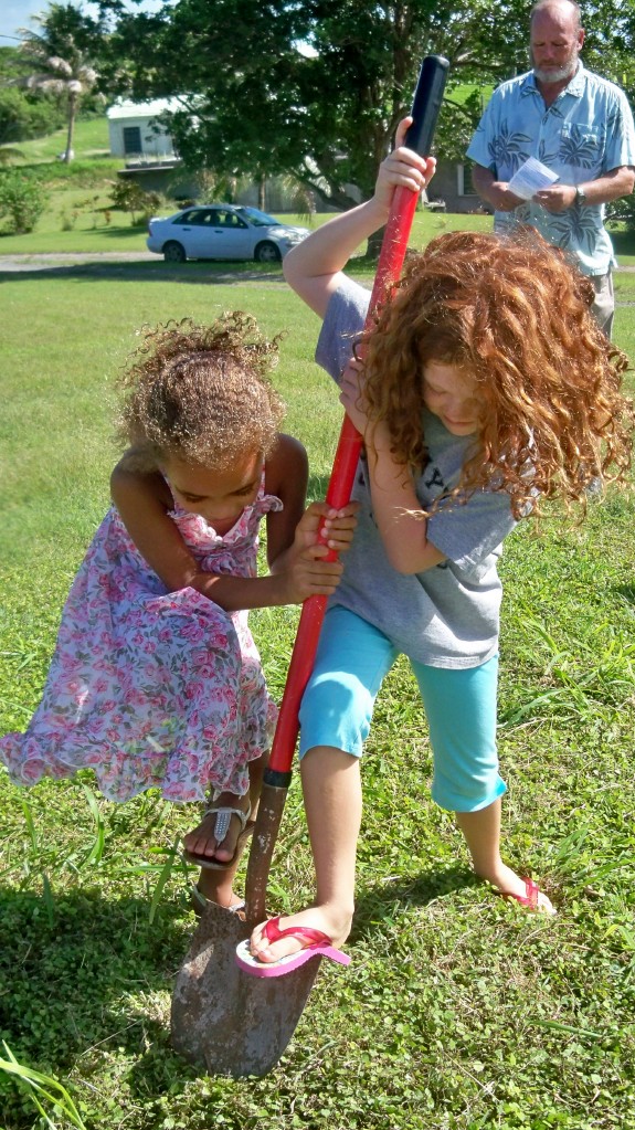 Scarlett Wallace (left) and Josie Calhoon join together in the groundbreaking. 