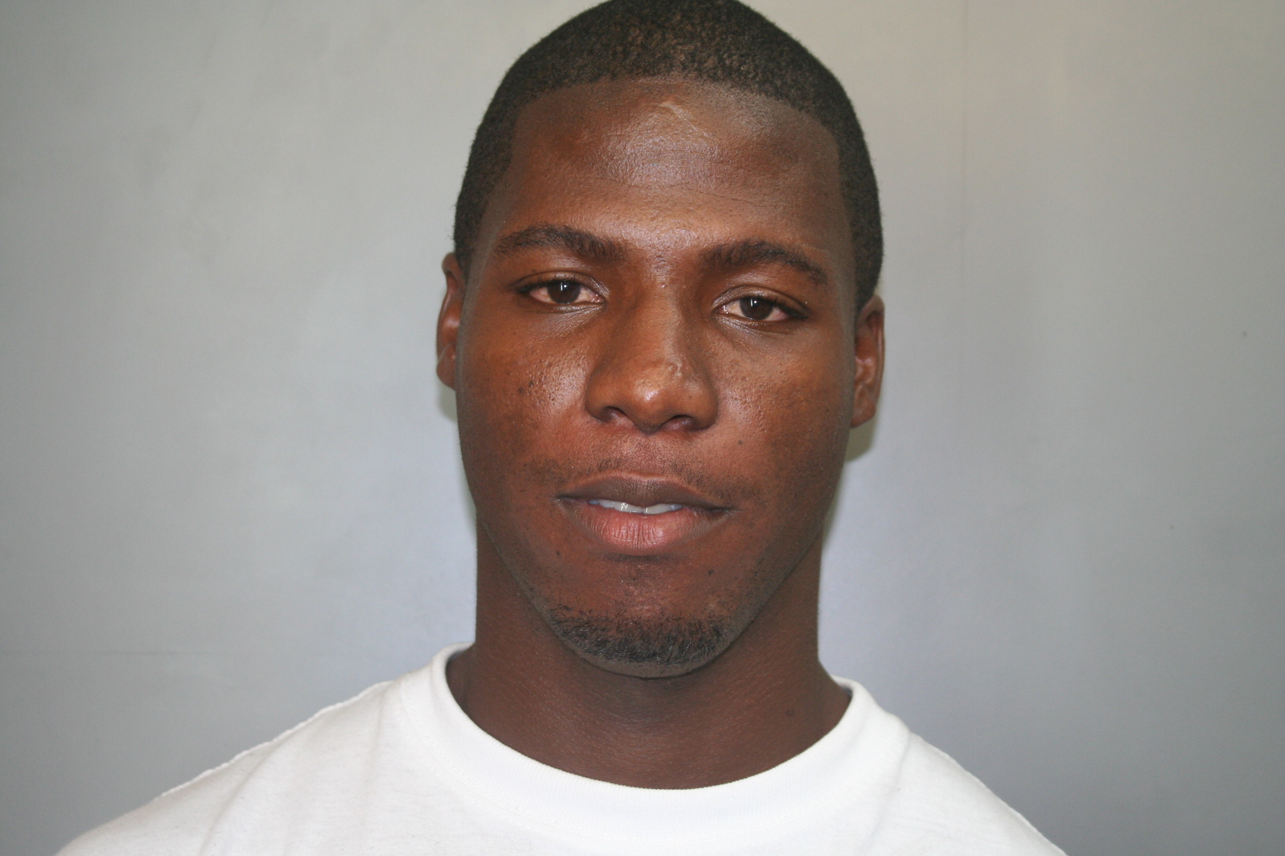 Eric McBean, age 28, was one of four men arrested Tuesday night after gunshots were reported near Larsen Elementary.