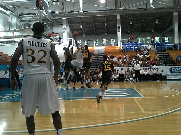 Drexel's Derrick Thomas looks on as his teammate attempts to score.