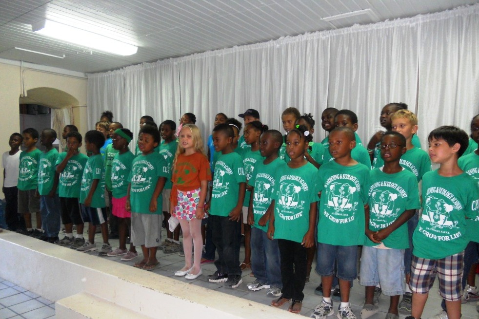 Children from the 20th Gardening and Ecology Academy sing their class song.
