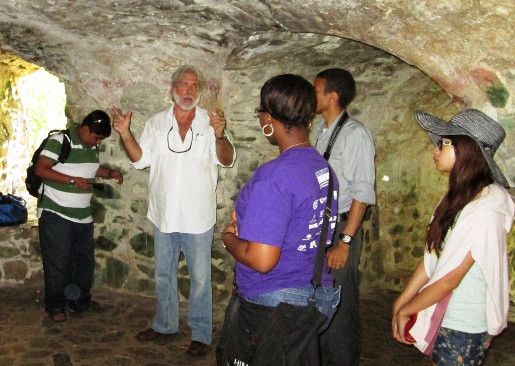 Historian David Knight with the V.I. Scholars program students inside the lower level of the Estate Catherineberg windmill.