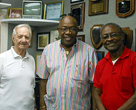 Lee Carle (from left), Addie Ottley and Irvin "Brownie' Brown with WSTA's many radio awards. 