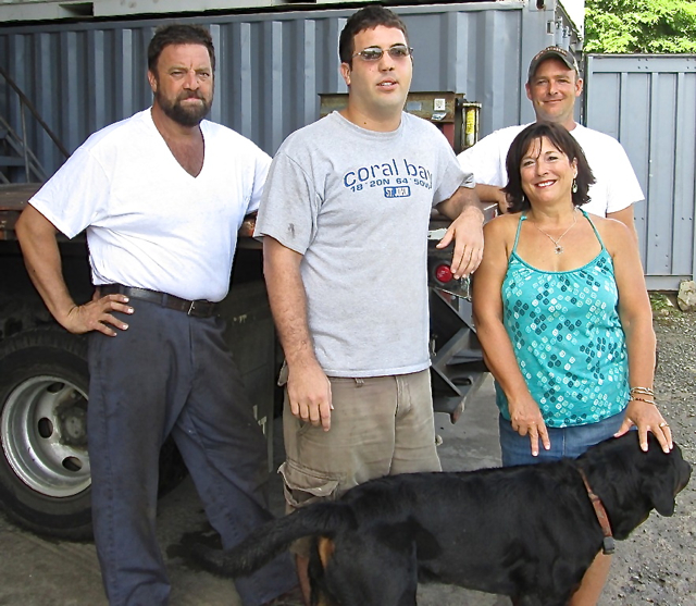 From left, Bill Dennis, Levi Dennis, Terry Dennis, and Eric Schnell with Harley the dog.