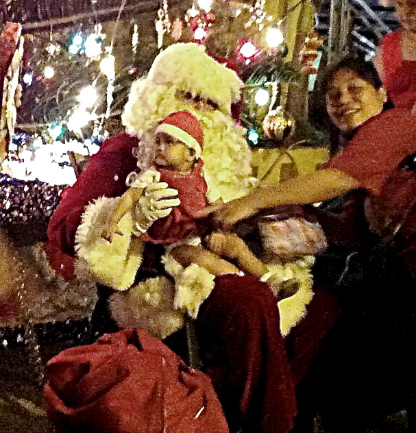 One of Frenchtown's newer citizens gets a first visit with Santa.