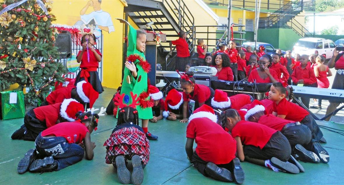Kindergartners at Jane E. Tuitt Elementary School interrupt their dance to bow to their tree (Molly Morris photo). 