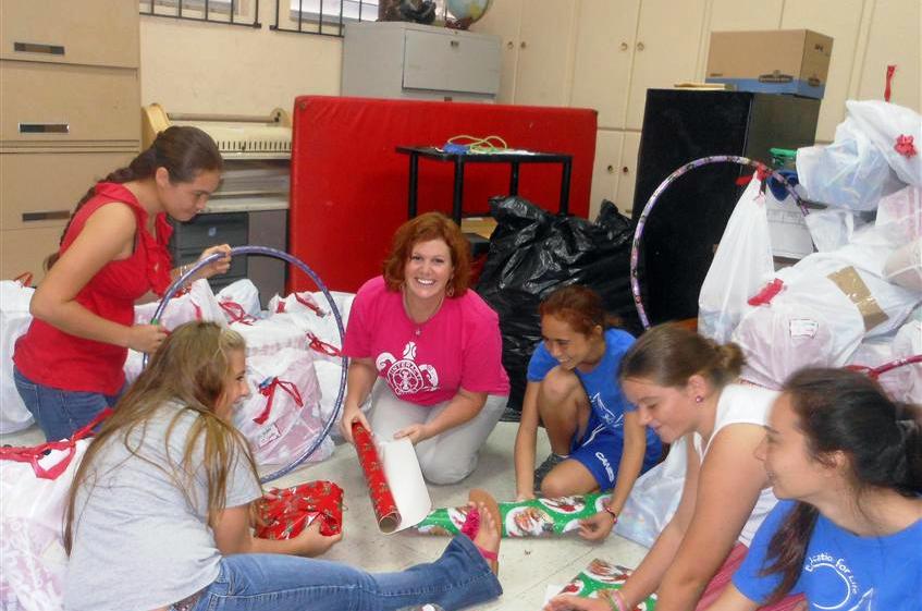 Elizabeth Elger, third from left, and elves almost finished bagging the gifts (Molly Morris photo). 