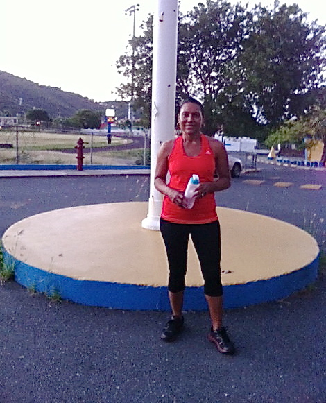 Annette Nicholson hydrates after a morning workout.