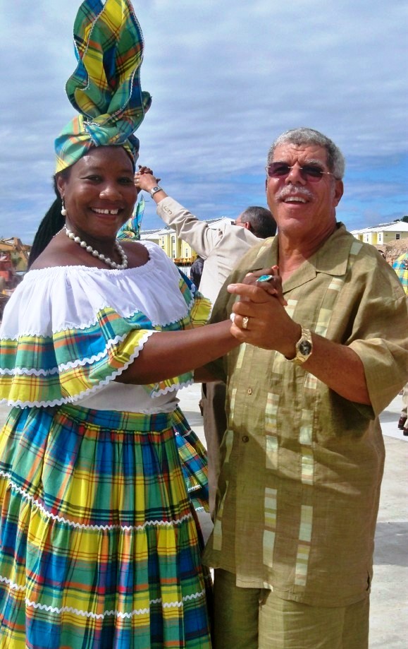 Louis Brown Jr., whose father the villas are named for, and Abigail Ward of "We Deh Yah" dance the quadrille (Carol Buchanan photo). 