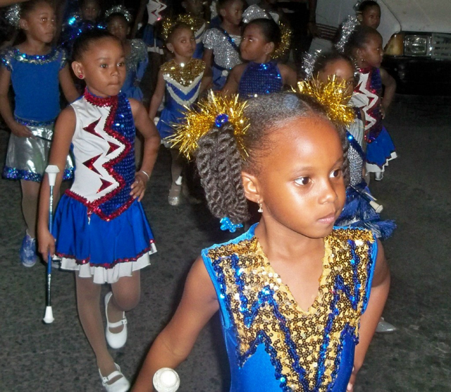 Tiny members of the St. Croix Majorettes strut through Christiansted in the Ole-Time Night Parade.
