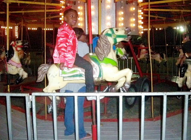 Jaelyn Bailey rides the merry-go-round.