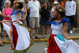 Traditional Dominican dancers twirl their skirts.