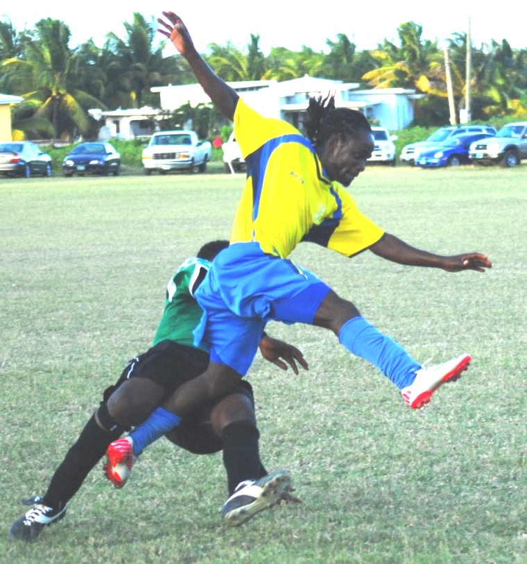 Helenites attacking winger Johnas Lesmond evades a hard tackle by a Skills defender.