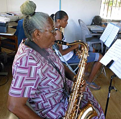 Thelma Walters plays tenor saxophone in the ensemble.