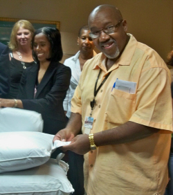 Glentis Matthew, JFL laundry manager, checks out the new pillows.