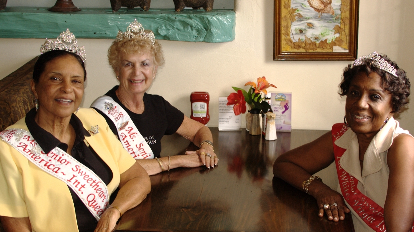 Clockwise from left, Toya Andrew, Carol Tuohy and Ida White relax at Betsy's Bar. Photo by Karen Holish.