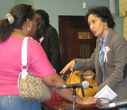 Sen. Nereida Rivera-O&rsquo;Reilly (right) chats with St. John resident Nydia Lewis.