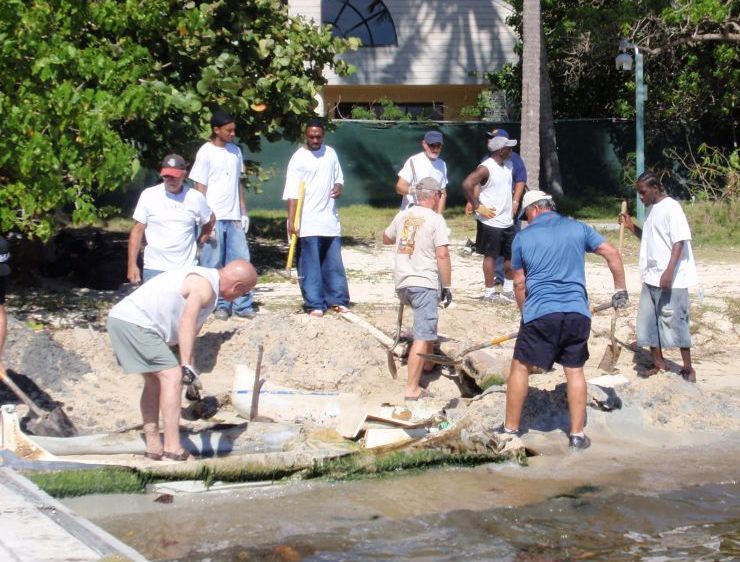Community members organized by My Brothers Workshop volunteers on St. Thomas take part in a service project, clearing the shoreline of Water Bay in 2012. (Source file photo)