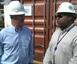 Seven Seas CEO Doug Brown (left) and WAPA's Hugo Hodge Jr. discuss the water project. 