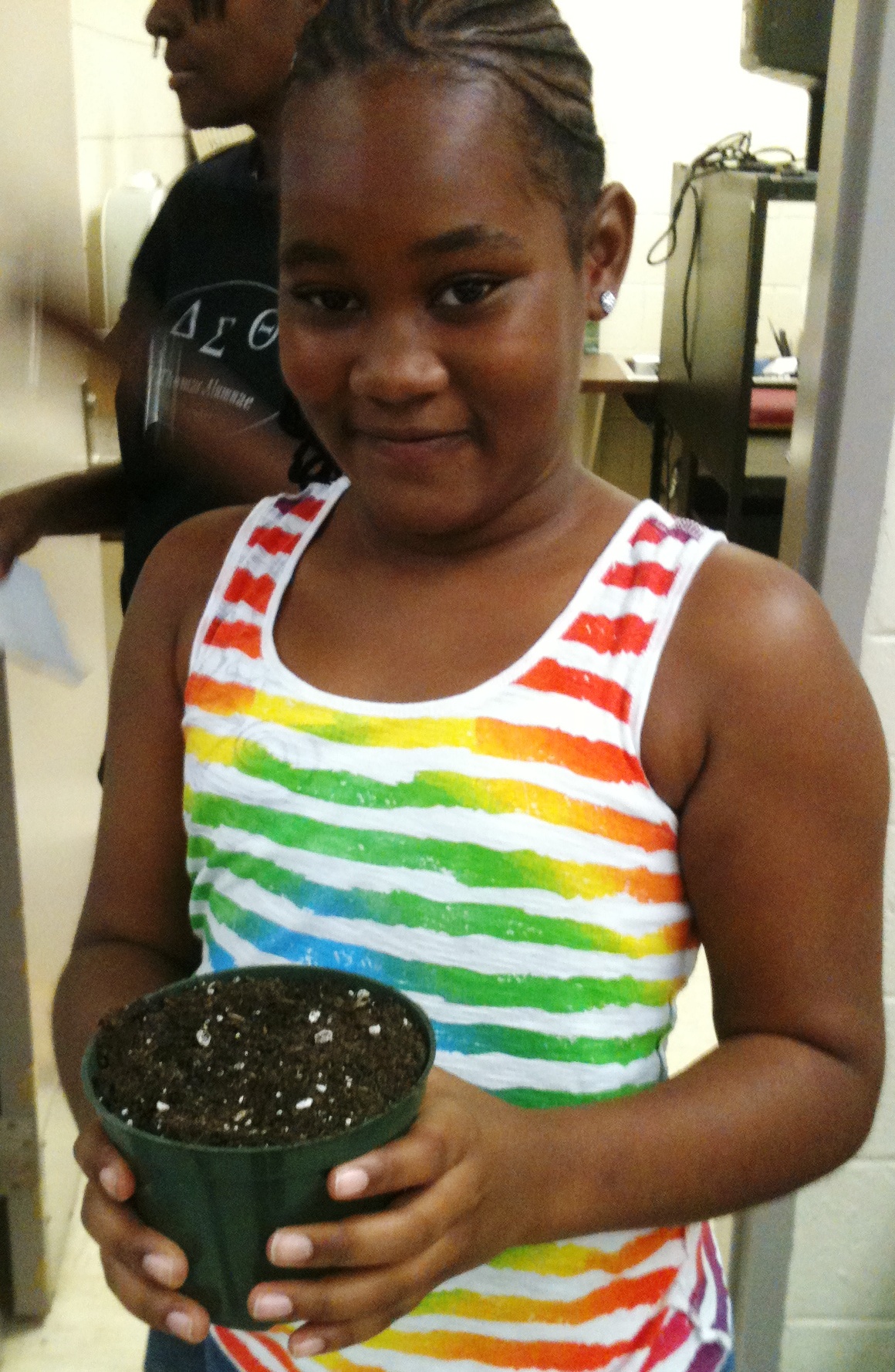 Students in Delta Theta Sigma Sorority's math and science program learn to grow beans.