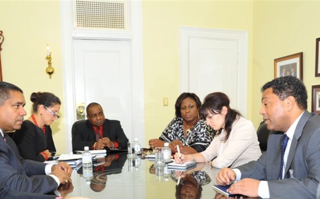 Earl Johnson, right, from the federal Department of Health and Human Services Office of Family Assistance, discusses programs available to the Virgin Islands during a Government House meeting.