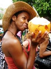 Abeje Maolud-Sneed enjoys a coconut at the 2011 festival.
