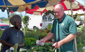 Grantley Samuel (left) and Don Bailey talk local food.