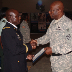 Lt. Col. Beresford F. Edwards (left) receives a commendation from Gen. Elton Lewis.