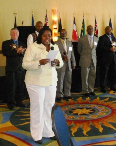 Anti-Gang Committee chairwoman Jacqueline Freeman presents gifts to conference presenters.